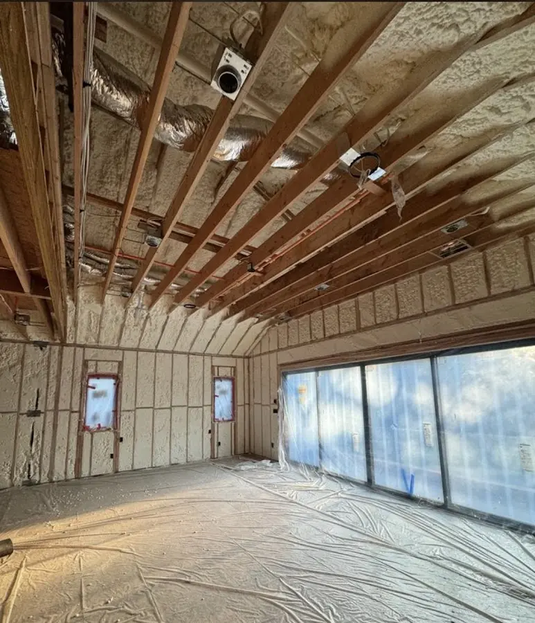 Interior walls and ceiling insulated with spray foam during new construction in Brownfields